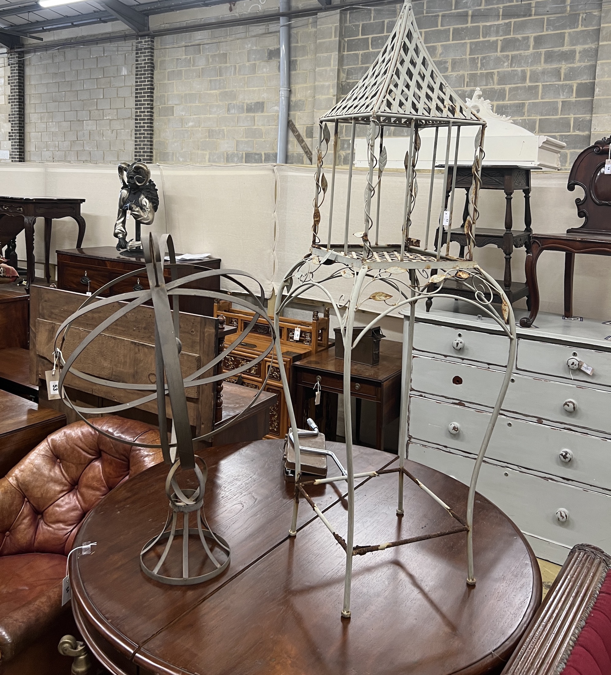 A painted metal armillary sphere, height 84cm together with a lantern