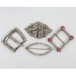 Four assorted paste set buckles, largest 6cm