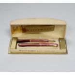 A boxed Waterman's pen and pencil Ladies Writing Set, comprising a pink striated model 512V and