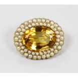 An Edwardian 15ct gold split pearl and citrine brooch, 3cm