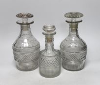 Three Georgian/Regency cut glass decanters, including a liqueur decanter, all with flattened