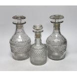 Three Georgian/Regency cut glass decanters, including a liqueur decanter, all with flattened