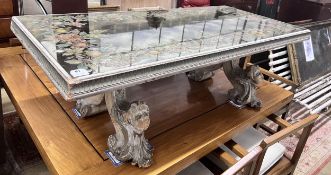 An Italian carved pine rectangular coffee table with painted mirrored top, width 141cm, depth