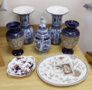 Seven ceramic pieces including a pair of Royal Doulton vases, Coalport dish and Delft jar and cover,