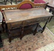 A small Jacobean revival oak low potboard dresser, width 116cm, depth 43cm, height 73cm