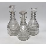 Three William IV cut glass decanters, all in a similar design with three neck rings and two with