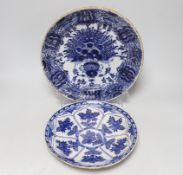 Two floral blue and white Delft plates, the largest 31cm in diameter