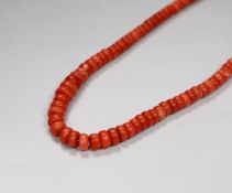 A coral bead necklace, overall 101cm