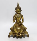 A Sino-Tibetan gilt bronze figure of Tara set with cabochon jewels, 23cm high