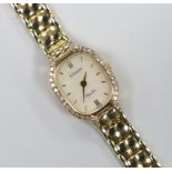 A lady's 9ct gold Tissot wrist watch, with diamond set mother of pearl dial and quartz movement