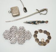 A late Victorian silver and hardstone Scottish dirk brooch, 11.75cm, an Edwardian silver vesta case,