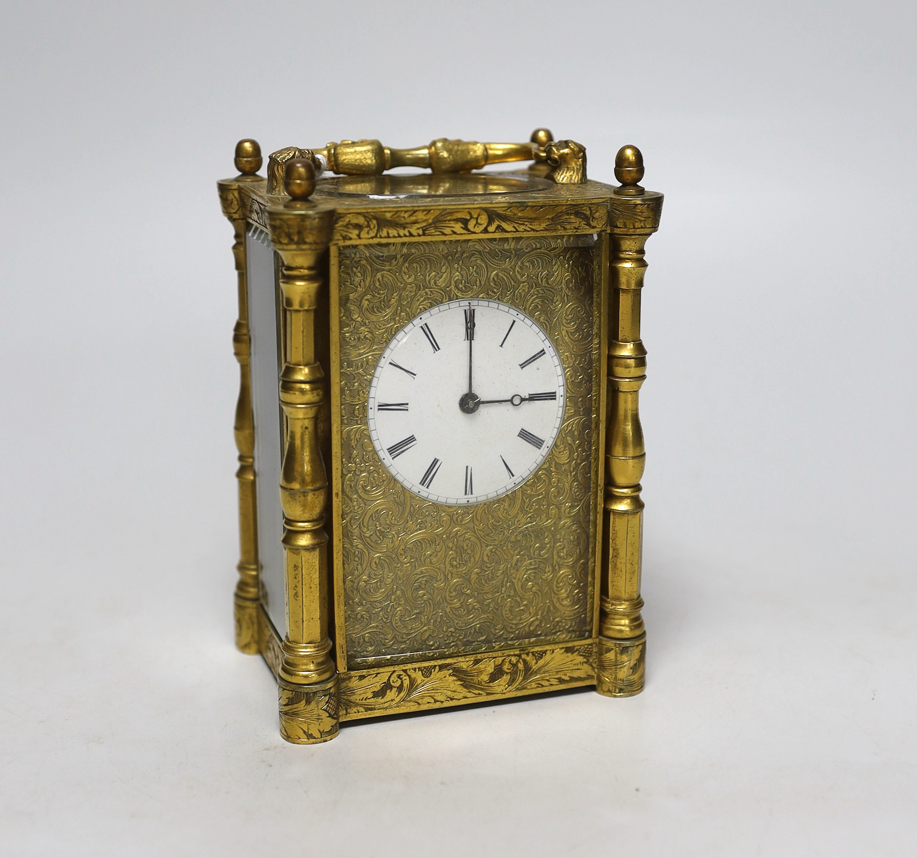 A mid 19th century French engraved gilt brass carriage clock, with tooled leather case, 16cm high