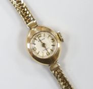 A lady's 9ct gold Baume wrist watch, gross 11.2 grams