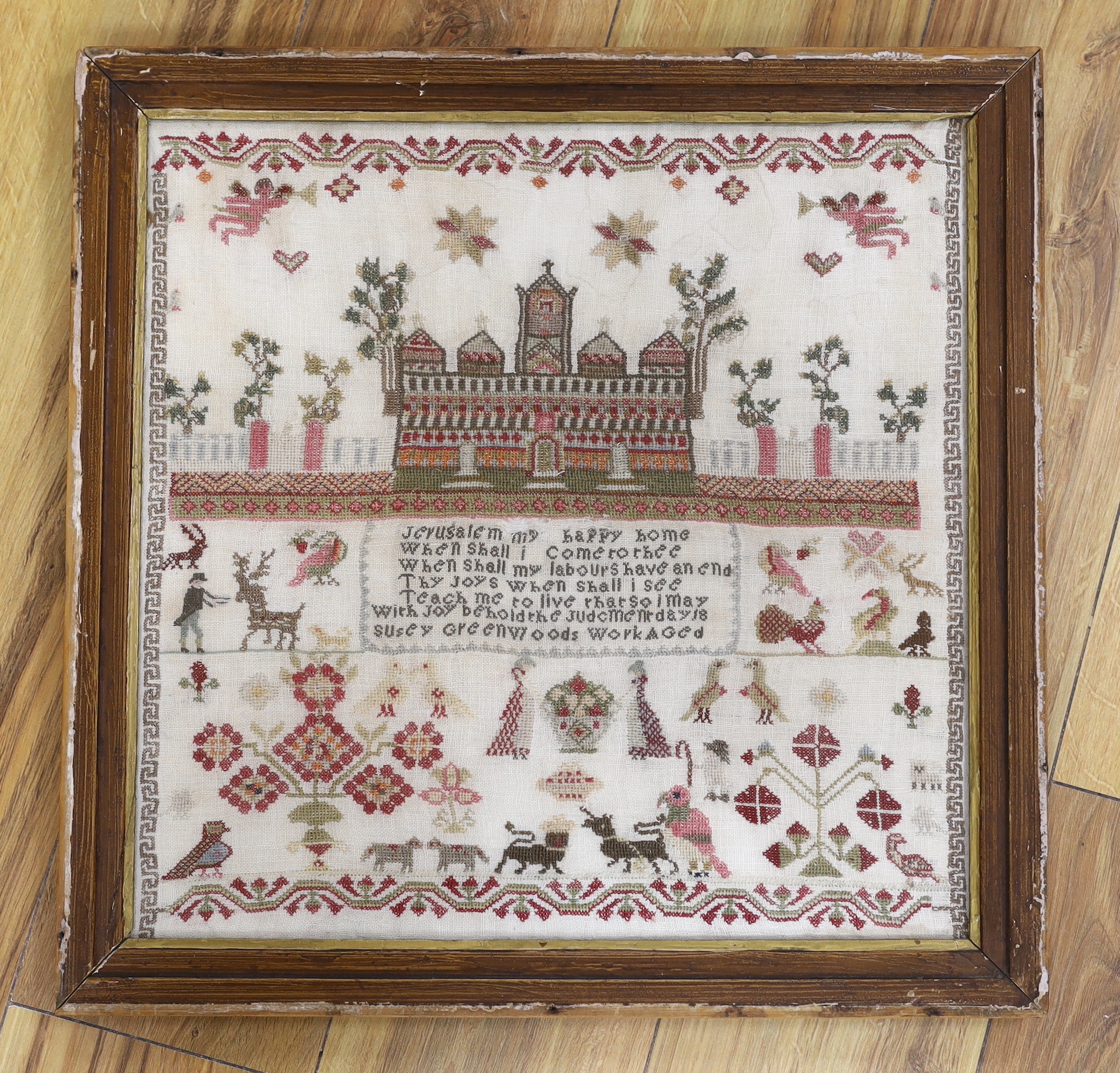 A 19th century sampler worked by Susey Greenwoods, embroidered with a church and religious verse,