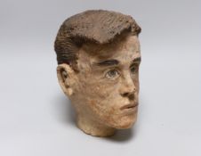 A terracotta bust of a boy, back of neck signed, 23cm