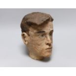 A terracotta bust of a boy, back of neck signed, 23cm