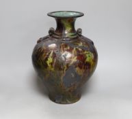 A large Raku urn with red and green glaze, incised AM to the base, 35cm high