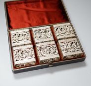 A cased set of six Continental white metal napkin rings, of unusual rounded rectangular form, with