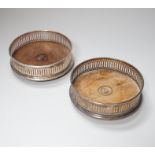 A pair of Elizabeth II silver mounted mahogany wine coasters, with pierced sides, London 1986, 12.