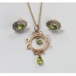 An early 20th century rose gold and peridot pendant necklace, on later chain, gross 3.5 grams and