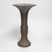 An 18th/19th century Chinese archaistic bronze beaker vase, gu, 34cm high