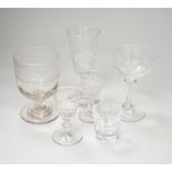 A collection of early 19th to early 20th century drinking glasses, including a set of twelve shot