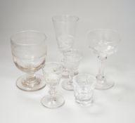 A collection of early 19th to early 20th century drinking glasses, including a set of twelve shot