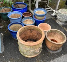 Twelve assorted earthenware garden planters, largest diameter 50cm, height 32cm