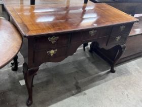 A Queen Anne revival feather banded walnut kneehole dressing table, width 129cm, depth 58cm,