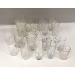 A collection of 19th and early 20th century drinking glasses, including beakers, some etched