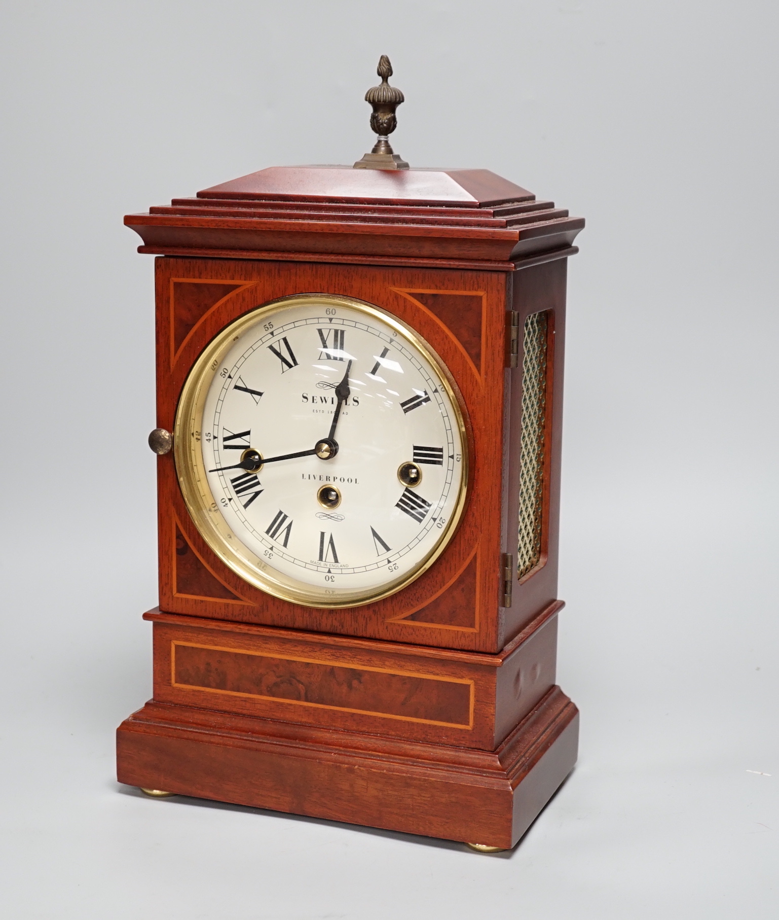 Sewills, Liverpool. An inlaid mantel clock with three train balance escapement movement, chiming