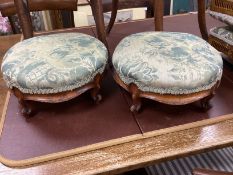 A pair of Victorian circular walnut foot stools, diameter 30cms