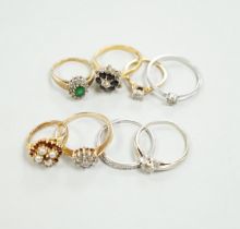 Eight assorted mainly modern 9ct gold and gem set rings, including solitaire diamond and diamond