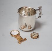 A George V silver christening mug, with dog handle, Sanders & Mackenzie, Birmingham, 1931, 77mm,
