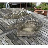 A reconstituted stone double greyhound head garden ornament, width 36cm, depth 23cm, height 28cm