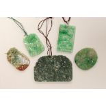 Five assorted jadeite pendants, largest 8cm wide