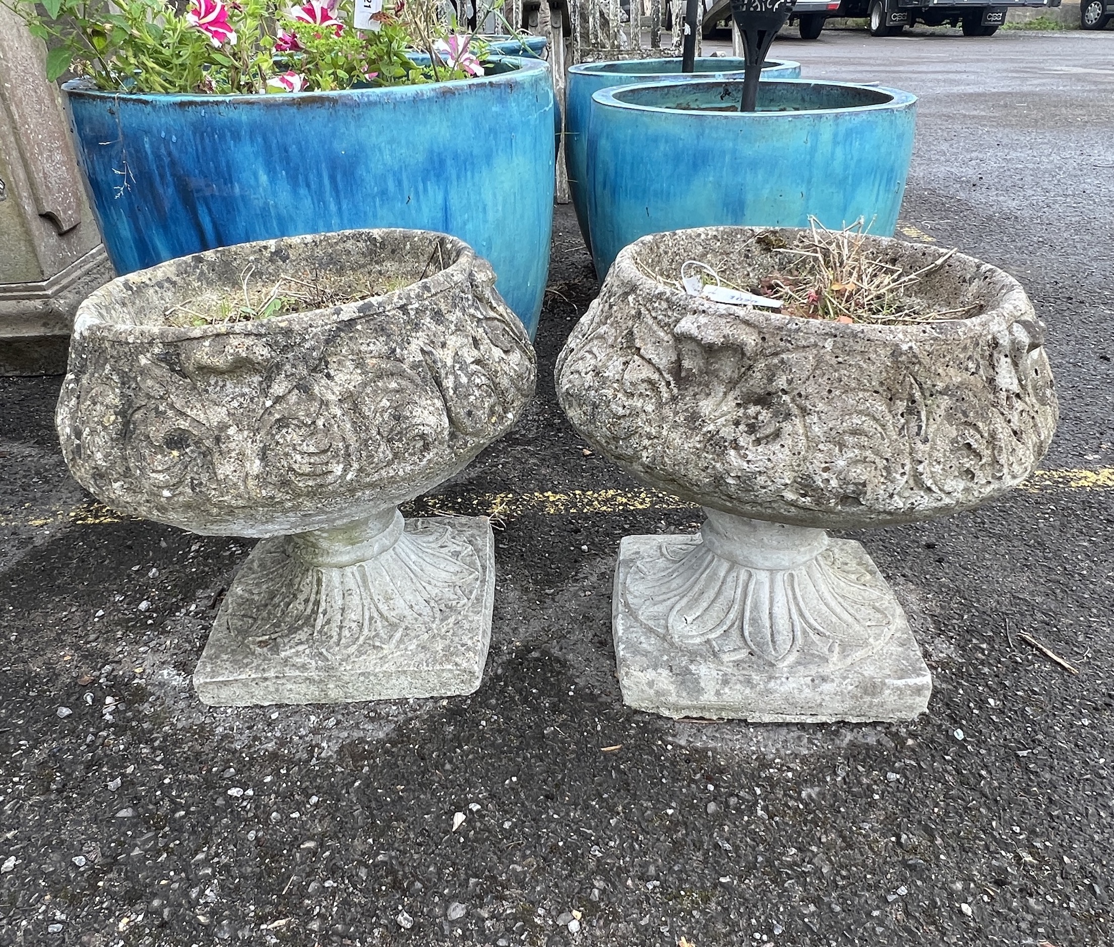 A pair of circular reconstituted stone garden planters, diameter 40cm, height 37cm