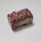 A Chinese chicken’s blood inscribed soapstone seal, carved with a dragon, 6cm Provenance - the