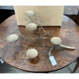 A set of four contemporary metal naturalistic five branch candle holders, length 60cm, height 20cm