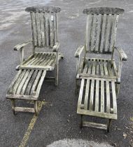 A pair of Barlow Tyrie weathered teak garden steamer chairs, width 60cm, height 96cm