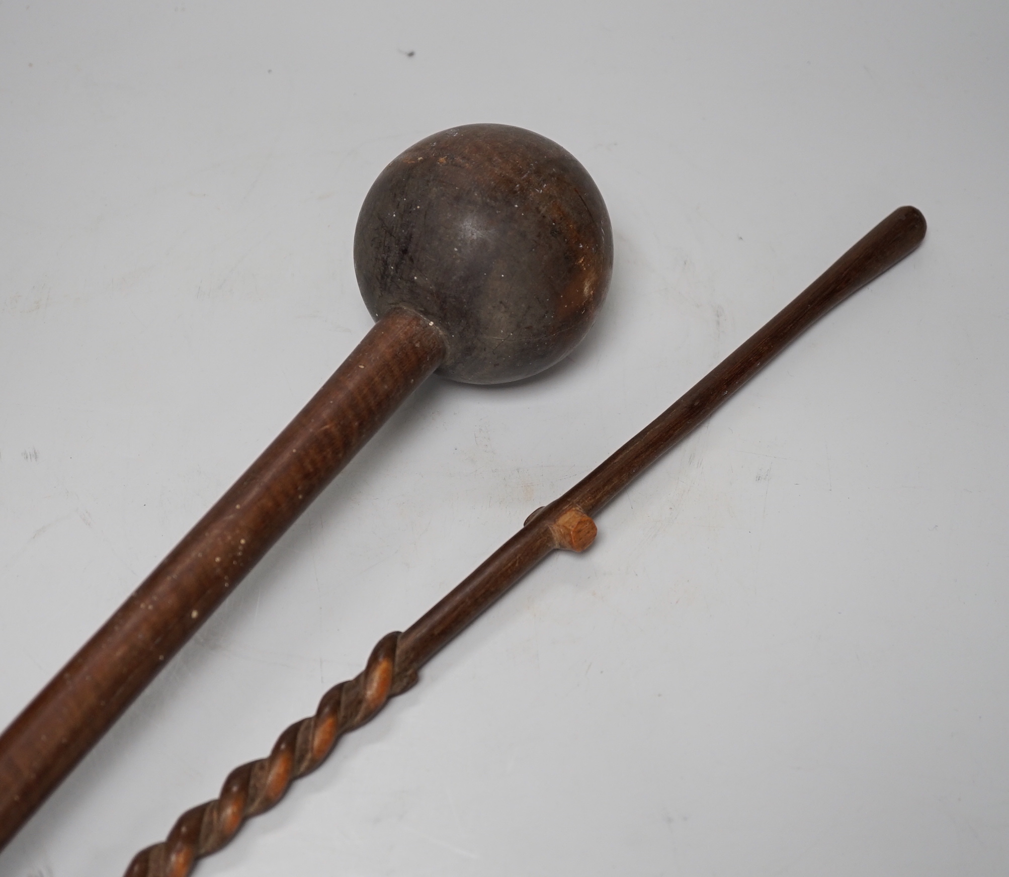 A knobkerrie and another tribal carving, longest 99cm