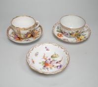 A Meissen style porcelain teacup and saucer together with a Dresden saucer and teacup and saucer