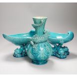 A pair of Burmantofts ‘dolphin’ pedestal bowls and a similar ‘dragon’ vase, 30cm