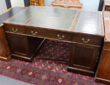 An early 20th century George III style mahogany pedestal partner's desk, width 152cm, depth 98cm,