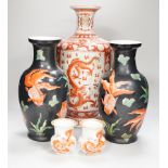 A Chinese iron red decorated ‘Dragon’ vase, a similar smaller pair of ‘Buddhist lion’ vases and a