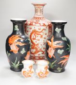 A Chinese iron red decorated ‘Dragon’ vase, a similar smaller pair of ‘Buddhist lion’ vases and a