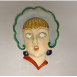 A Czechoslovakian Art Deco face mask, 22cm