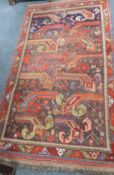 An antique Goradis blue ground rug 220 x 125cm