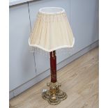 A Victorian style brass and ruby glass table lamp with shade, 81cm