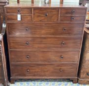 An early 20th century Heal and Son mahogany nine drawer chest, bears circular ivorine plaque,